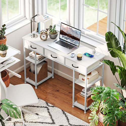 White home office computer desk with integrated charging station White home office computer desk with integrated charging station